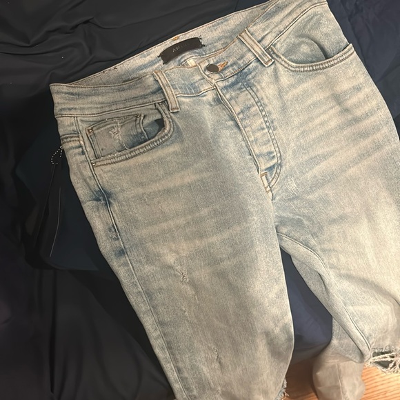 There are blue Amiri jeans bought from a store by the name The Gallery Chicago.